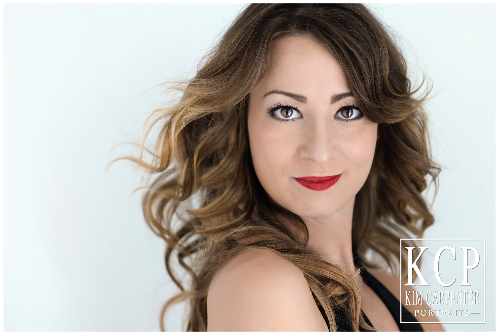 Gorgeous woman with bright red lips. Lakeland Photographer, professional headshots