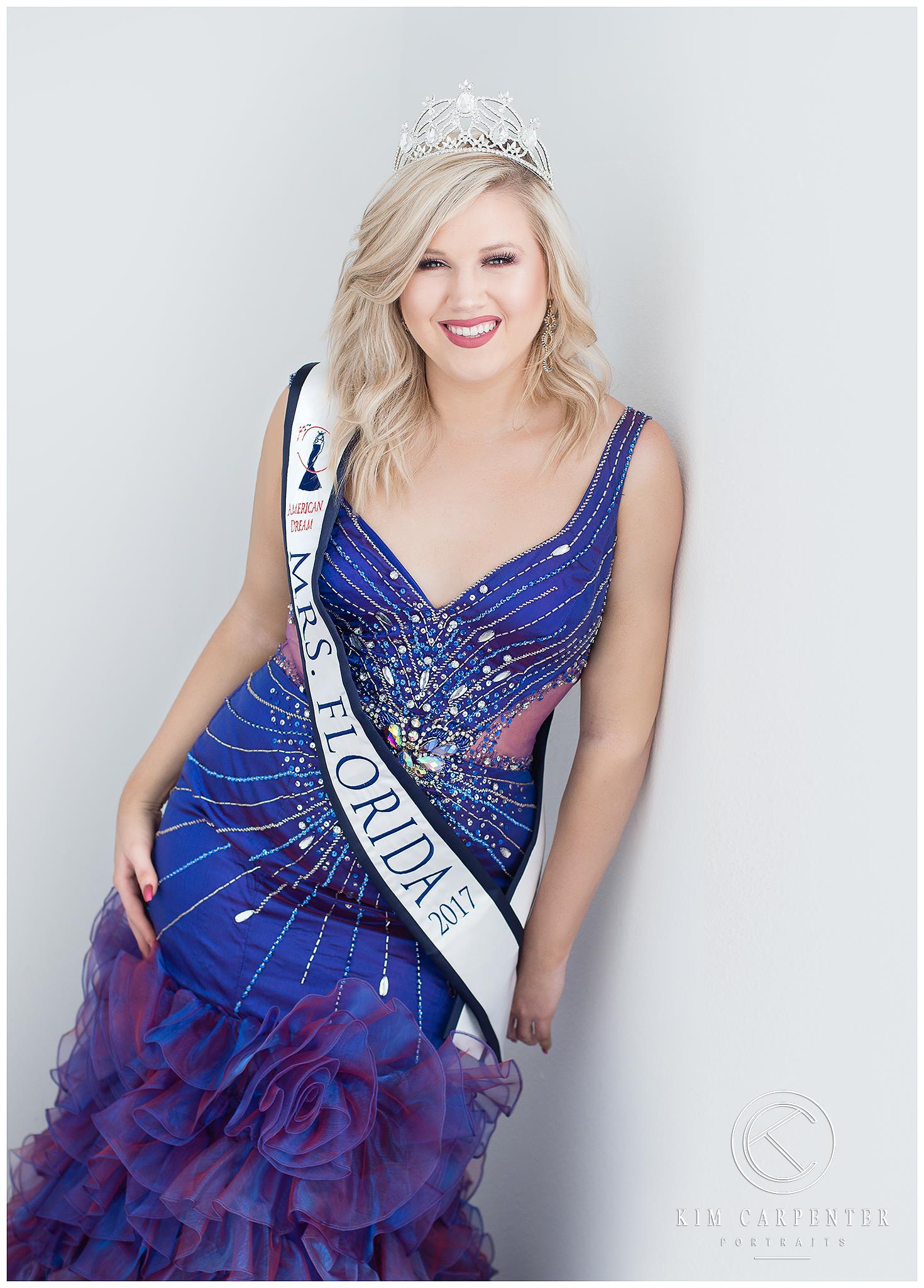 Woman wearing blue dress and sash that says Mrs. Florida.