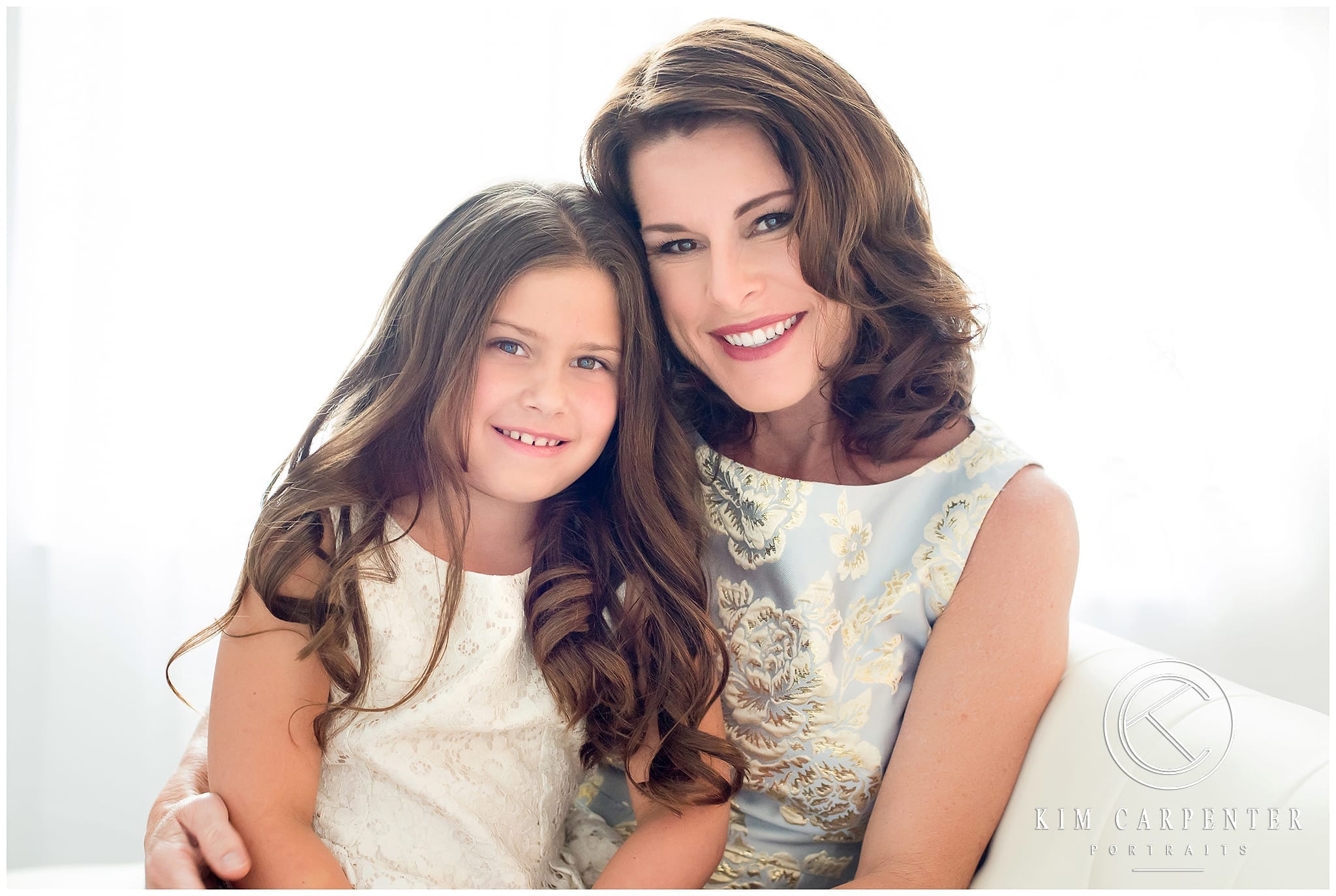 Lakeland Photographer - Beautiful Mother and daughter portrait sitting on a couch in beautiful dresses