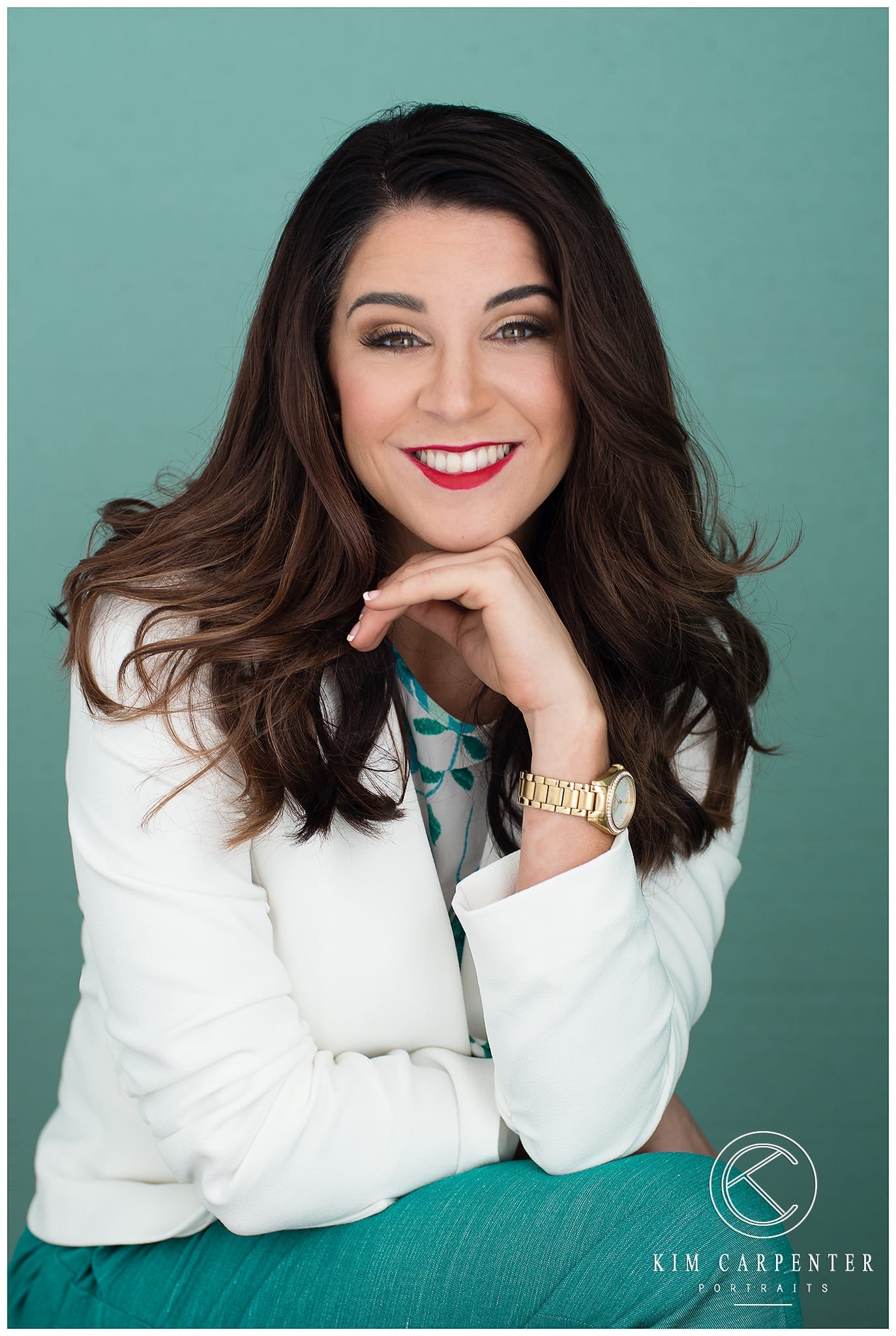 Lady wearing a white jacket and has a watch on her wrist. Lakeland Photographer, professional headshots